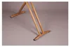 Close-up of the wooden legs and base of an ironing board. Produktbild-Vorschau