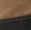A close-up view of workwear fabric with stitching. Produktbild-Vorschau