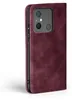 A close-up side view of a burgundy flip-style phone case for a Xiaomi Redmi 12C. Produktbild-Vorschau