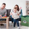 A family playing with toys in a living room. Náhled obrázku produktu