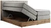 A king-size boxspring bed with its storage compartment open, revealing the wooden frame and the mattress mechanism. Produktbild-Vorschau