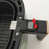 A close-up view of the handle and basket attachment mechanism of a Philips Airfryer. Produktbild-Vorschau