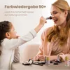 A young girl is applying makeup to her mother's face, with various makeup products scattered on the table. Anteprima dell’immagine prodotto