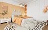 A child's bedroom with a bed, nightstand, and rug. Náhled obrázku produktu