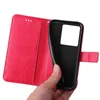 A hand holding a red flip phone case with a floral design. Produktbild-Vorschau