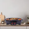 A black electric grill and hot pot is shown on a kitchen counter with food cooking on it. Produktbild-Vorschau