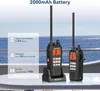 Two walkie-talkies are shown on a table with a body of water in the background. Náhled obrázku produktu