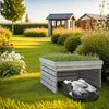 A robot lawnmower is parked under a wooden structure in a well-maintained garden. Náhled obrázku produktu