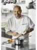 A man in a kitchen preparing food. Anteprima dell’immagine prodotto