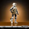 A Star Wars Vintage Collection Scout Trooper action figure with Grogu in its satchel, standing against a gradient brown background. Náhled obrázku produktu