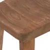 A close-up view of a wooden stool's surface and leg. Náhled obrázku produktu