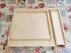 A wooden pastry board with a sliding tray, placed on a floral patterned tablecloth. Anteprima dell’immagine prodotto