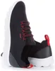 A pair of navy blue GEOX Spherica A sneakers with red laces and accents, shown from a side-angle on a white background. Produktbild-Vorschau