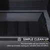 Close-up of the interior of a black wood-burning stove, highlighting the removable ash pan and featuring marketing text about simple clean-up. Náhled obrázku produktu