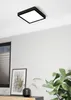 A modern interior scene with a ceiling light, artwork, and a plant. Produktbild-Vorschau