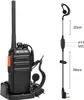 A black walkie-talkie with an orange button is shown in a charging cradle, next to a black headset with a microphone. Dimensions are indicated on the headset cable. Náhled obrázku produktu