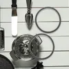 Kitchen utensils and replacement parts arranged on a white wooden surface. Produktbild-Vorschau
