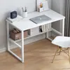 A white computer desk with shelves, a laptop, books, and a clock. Podgląd zdjęcia produktu
