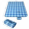A picnic blanket is shown unfolded and folded, with dimensions indicated. Produktbild-Vorschau