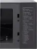 A close-up of the side panel of a microwave oven showing a control panel with various cooking modes and instructions. The interior of the microwave is partially visible. Produktbild-Vorschau