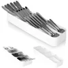 A collage of a white cutlery organizer tray filled with stainless steel cutlery and a separate empty tray. Anteprima dell’immagine prodotto
