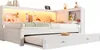 A white daybed with a pull-out trundle bed, featuring integrated shelving and LED lighting. Voir les images du produit