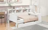 A white daybed with drawers and a bookshelf headboard, set up in a room with a desk and chair. Produktbild-Vorschau
