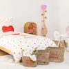 A child's bedroom with a bed, storage baskets, and a coat rack. Náhled obrázku produktu