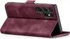 A burgundy flip cover case for a Samsung Galaxy S22 Ultra phone is shown from a side-angle, with the phone inserted and the cover open. Produktbild-Vorschau