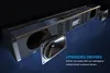 A soundbar with its internal speaker drivers exposed, set against a dark, moody background with blue lighting. Podgląd zdjęcia produktu