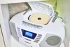 A white Blaupunkt boombox with a CD open is placed on a shelf. Produktbild-Vorschau