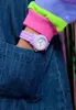 A close-up of a child's wrist wearing a purple watch, with part of a denim garment visible. Podgląd zdjęcia produktu