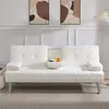 A white sofa bed is shown in a living room setting with artwork on the wall. Produktbild-Vorschau