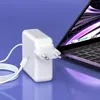 A white USB-C power adapter and cable are shown next to an open laptop. Produktbild-Vorschau