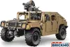 A tan-colored toy Humvee with a mounted gun, displayed on a white background. Produktbild-Vorschau