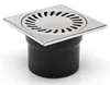 A square stainless steel floor drain with a black pipe fitting. Anteprima dell’immagine prodotto