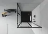 A top-down view of a modern black shower cabin and a black shower tray, with a wooden stool and towels to the side. Podgląd zdjęcia produktu