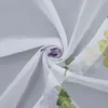 A close-up of a white sheer fabric with a floral pattern, swirled to show its texture and design. Produktbild-Vorschau