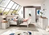 A bedroom with a large window, bed, nightstand, and wardrobe. Podgląd zdjęcia produktu
