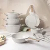 A set of cookware arranged on a surface with a neutral background. Náhled obrázku produktu