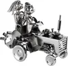 A metallic sculpture of a wedding couple on a tractor. Produktbild-Vorschau