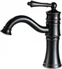 A close-up studio shot of a black and bronze vintage-style faucet. Náhľad obrázku produktu