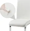 A close-up of a white chair seat with a finger pressing into the cushion to demonstrate its softness. Produktbild-Vorschau