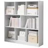 A white cube bookshelf filled with books, boxes, and a calendar. Náhled obrázku produktu