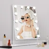 A vanity mirror with lights is displayed on a table with some cosmetic products. Podgląd zdjęcia produktu