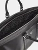 Close-up view of the interior of a black Guess weekender bag. Produktbild-Vorschau