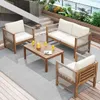 An outdoor patio setting with a wooden lounge set, coffee table, and drinks. Produktbild-Vorschau