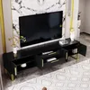 A black TV stand with gold accents is shown in a modern living room setting, with a large TV mounted on the wall behind it. Produktbild-Vorschau