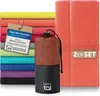 A stack of colorful microfiber towels and a rolled-up towel in a mesh bag. Náhled obrázku produktu