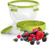 A transparent salad box with a green lid and a green divided insert, surrounded by a pile of fresh berries. Produktbild-Vorschau